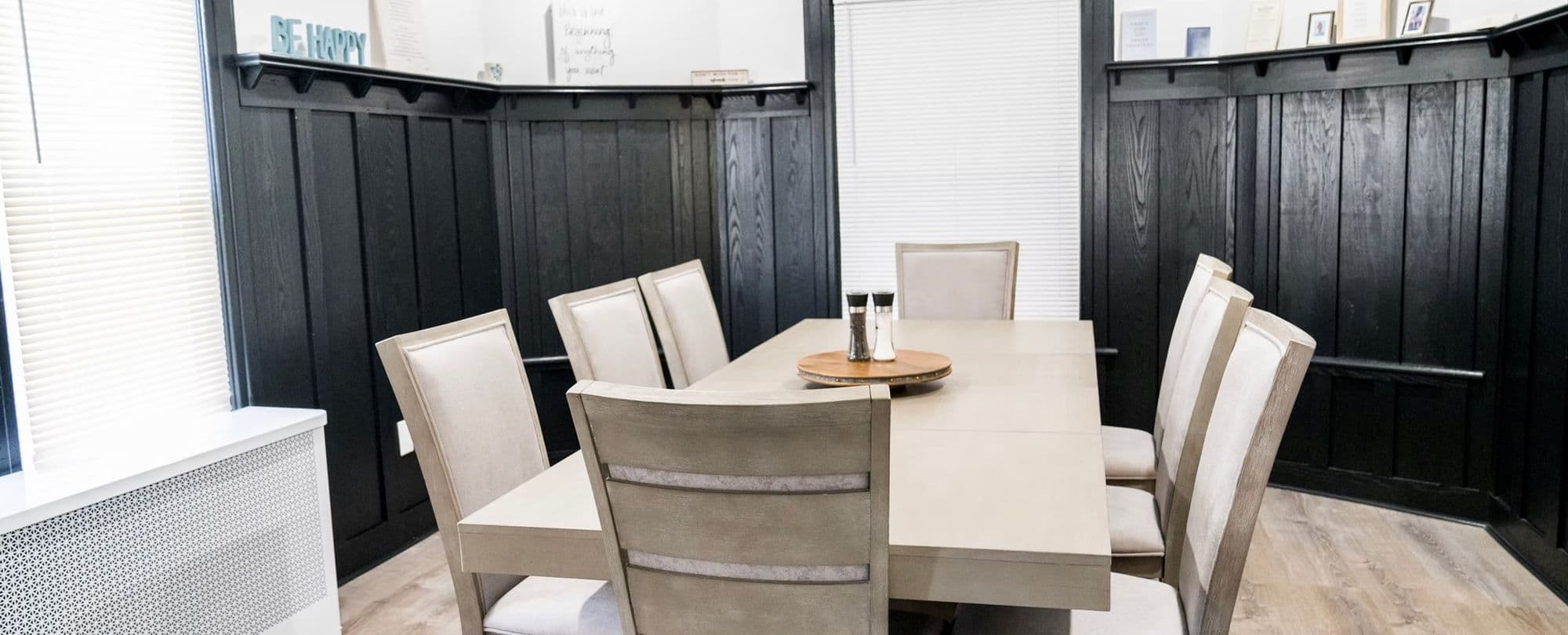 Freeport Sober Home — Dining Room (3 meals a day) | Long Island Sober Living | Integrity Sober Homes Family-style dining room set for three meals a day at Integrity Sober Homes men's sober house on Elliott Place in Freeport, Long Island